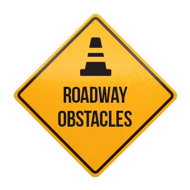 Defensive driving course details include roadway obstacles.